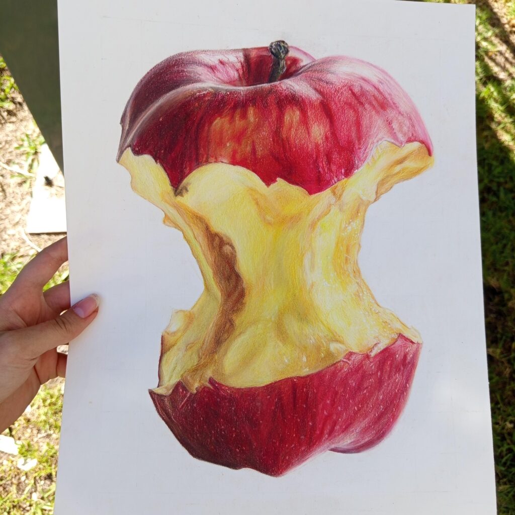 A realistic colored-pencil drawing of a mostly eaten red apple, with its yellow core and stem on white paper.