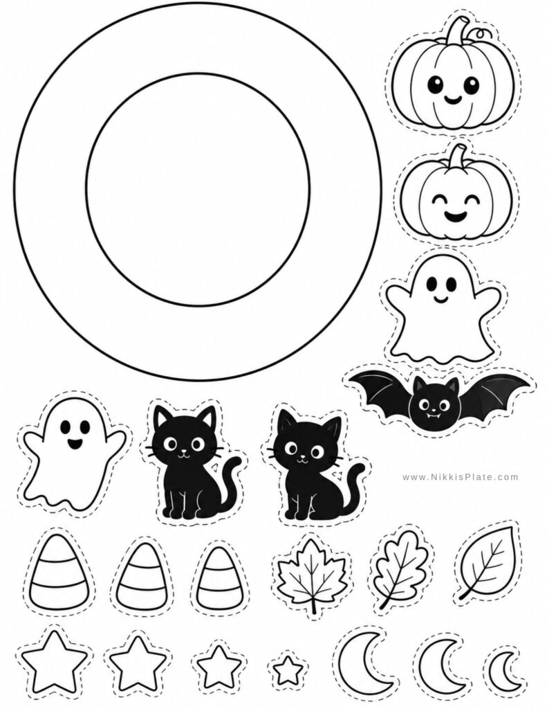 Black-and-white Halloween cutout sheet with a large circular ring and outlined decorations, including smiling pumpkins, ghosts, bats, cats, candy corn, leaves, stars, and crescent moons.
